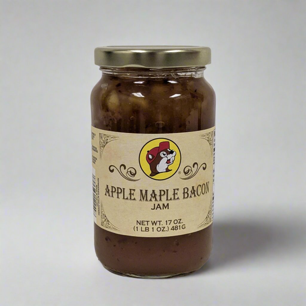  A 17 oz. jar of Apple Maple Bacon Jam with a golden lid, featuring a rustic label and showcasing its rich, chunky blend of apples, maple syrup, and smoky bacon.





