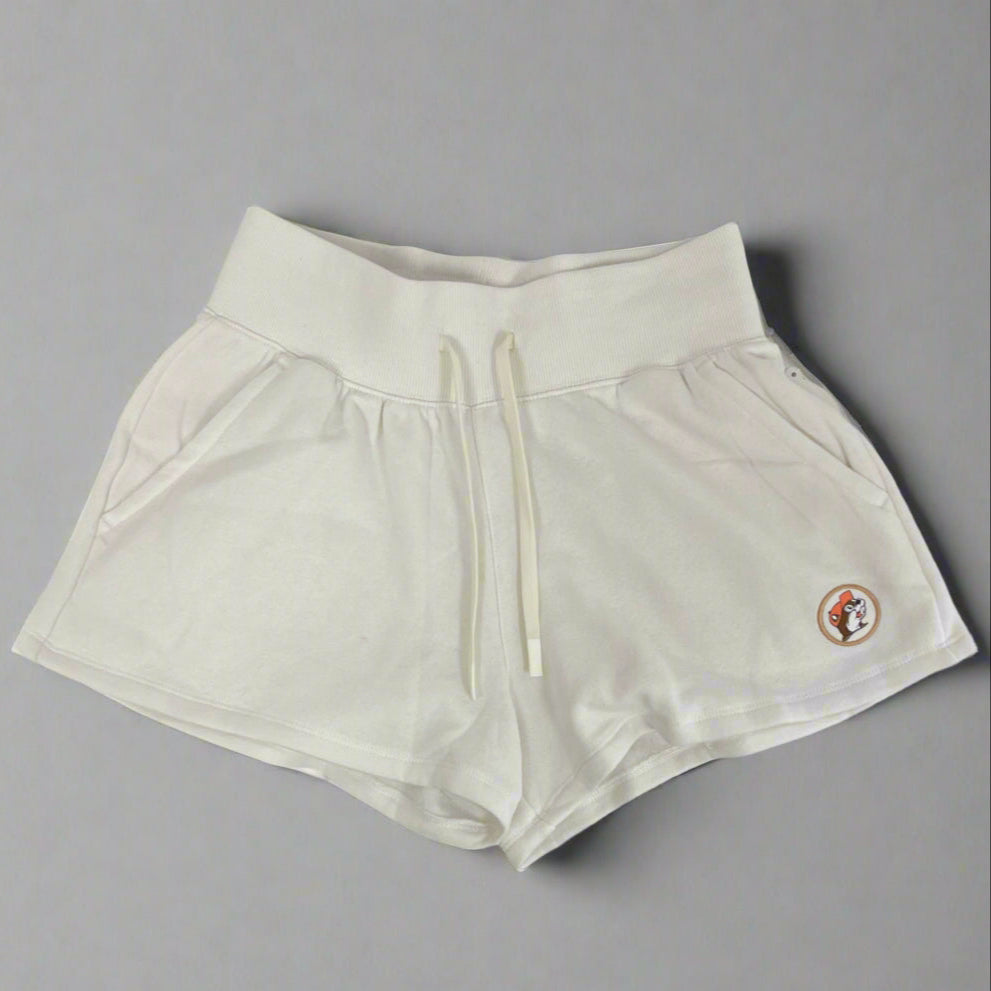 Fleece cream baja shorts with a Buc-ee's Logo in the corner.