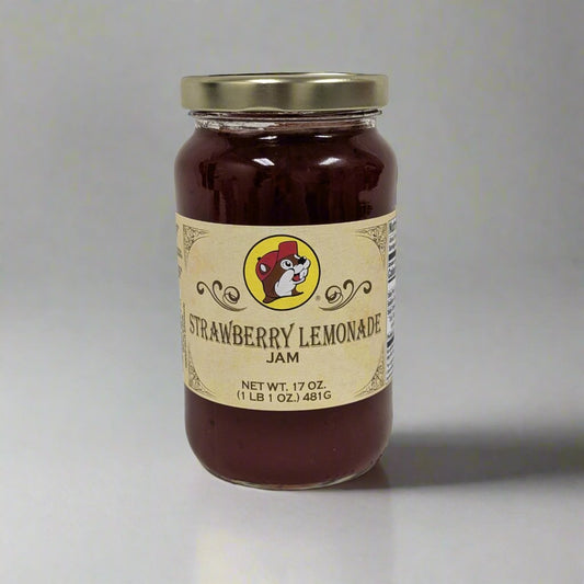 "Jar of Strawberry Lemonade Jam, 17 oz, featuring a creamy blend of sweet strawberries and tangy lemonade, displayed against a white background."

