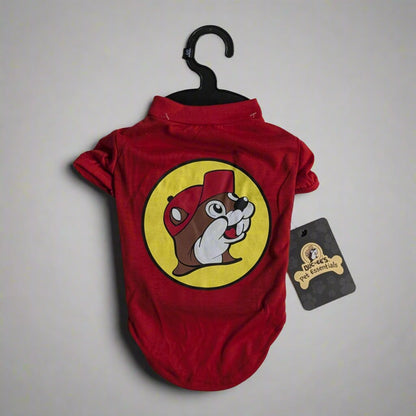 Red pet shirt featuring the Buc-ee's logo on the back with a black hanger and Buc-ee's Pet Essentials tag